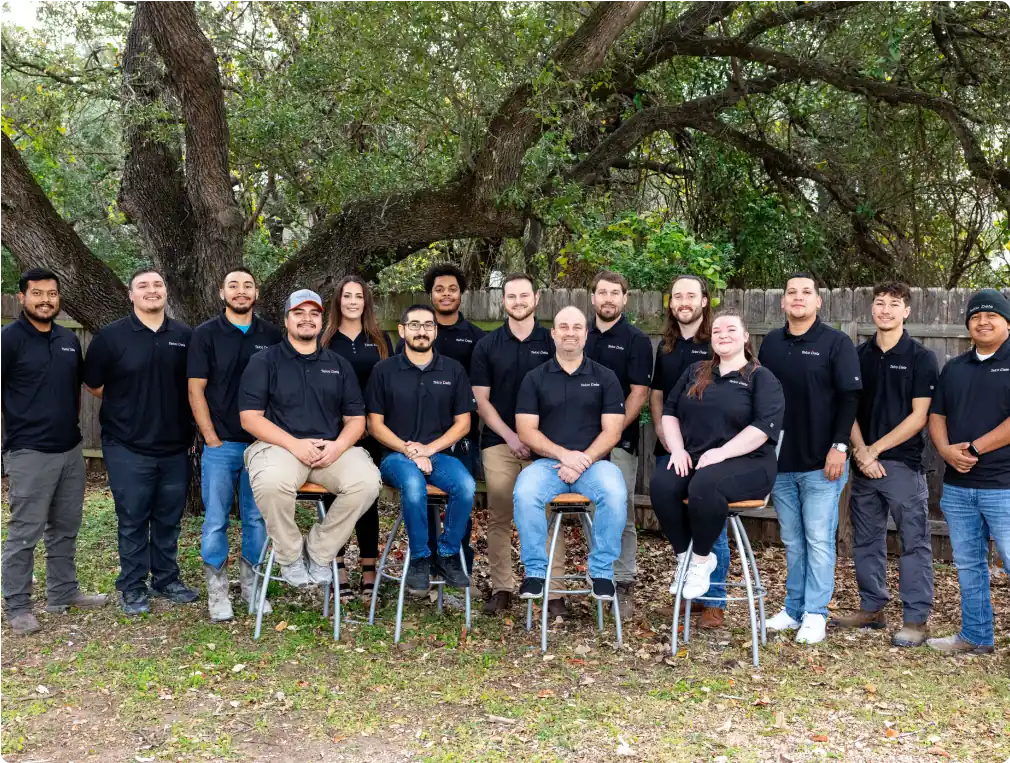 Photo of the entire Telco Data team. They are outside and wearing matching black shirts.